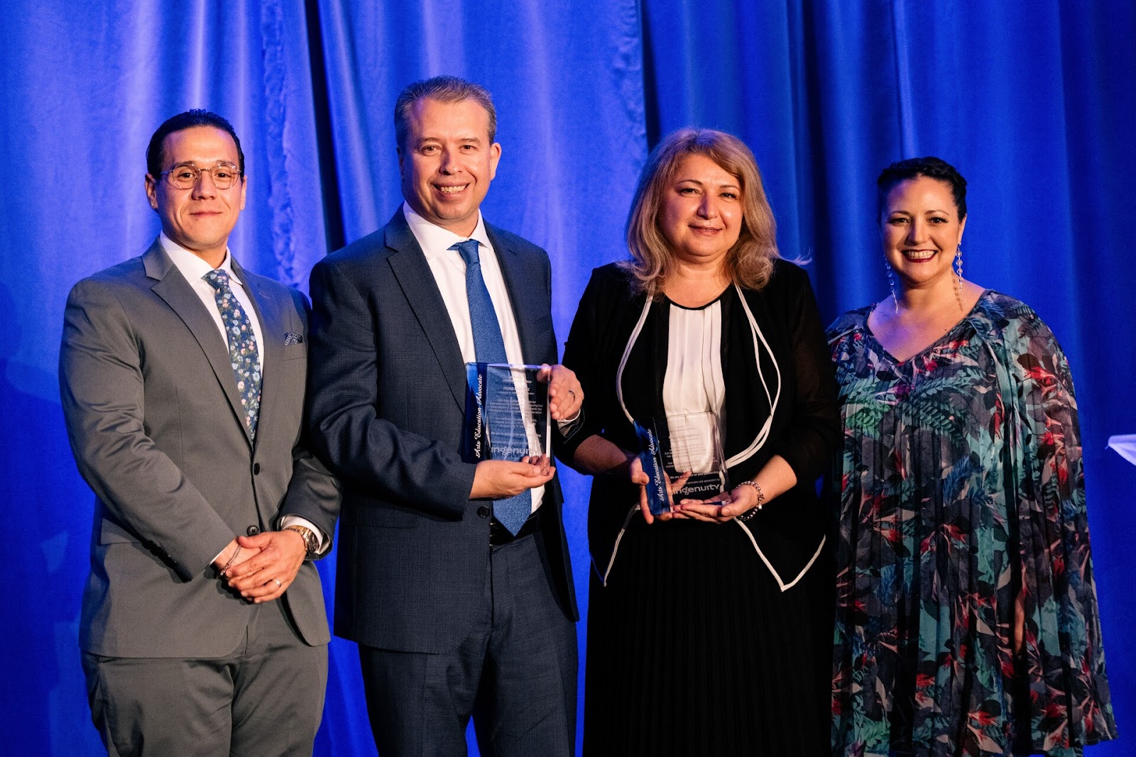 CEO and CEDO accept an award from Ingenuity