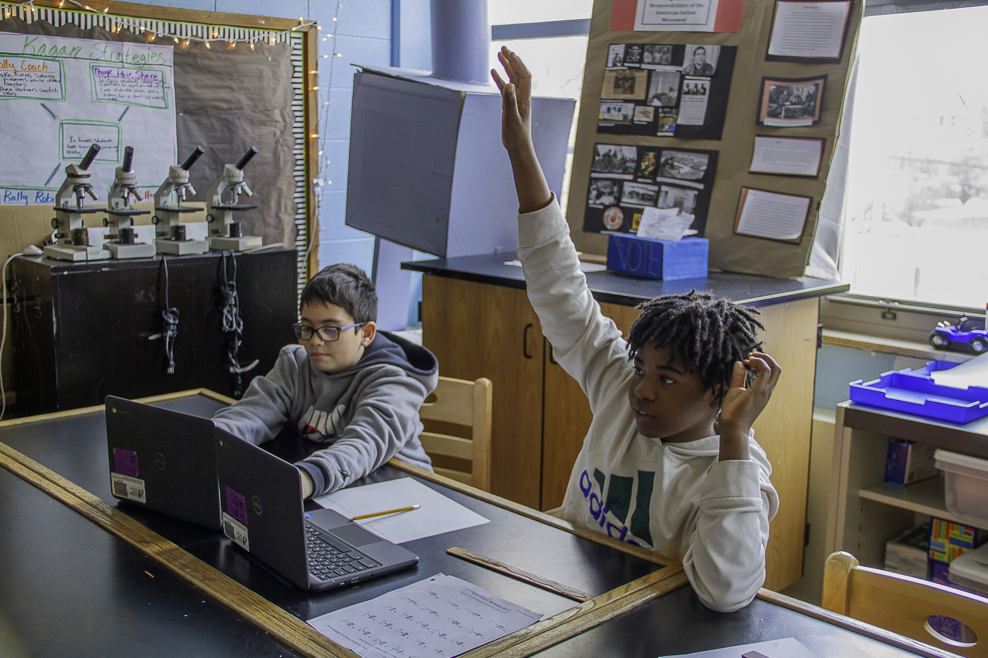 Two students working on laptops at Pritzker
