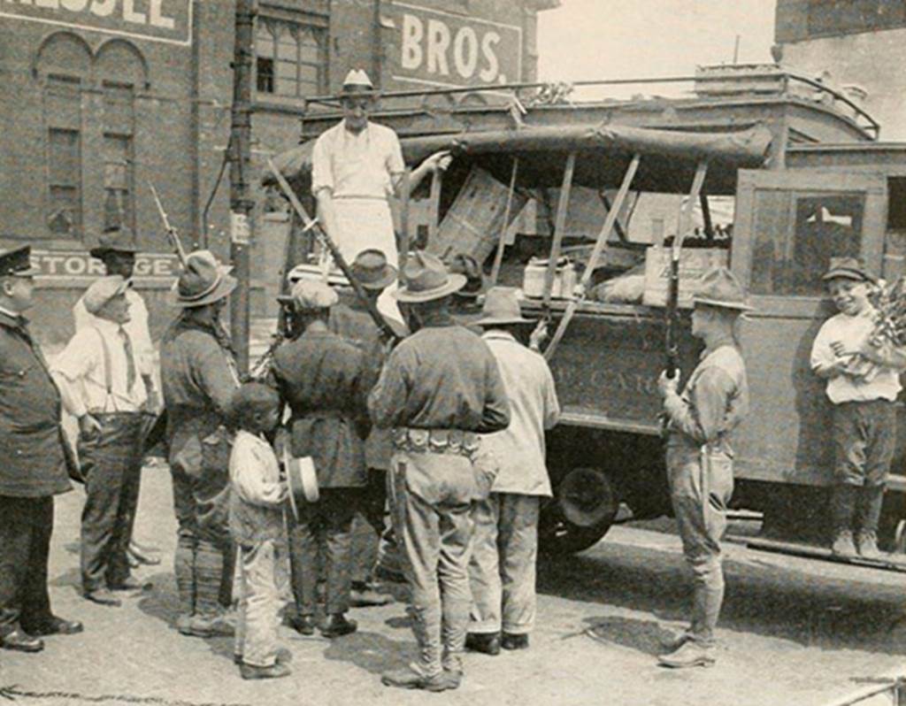 The Early History of Segregation in Chicago - Image of people at newspaper stand