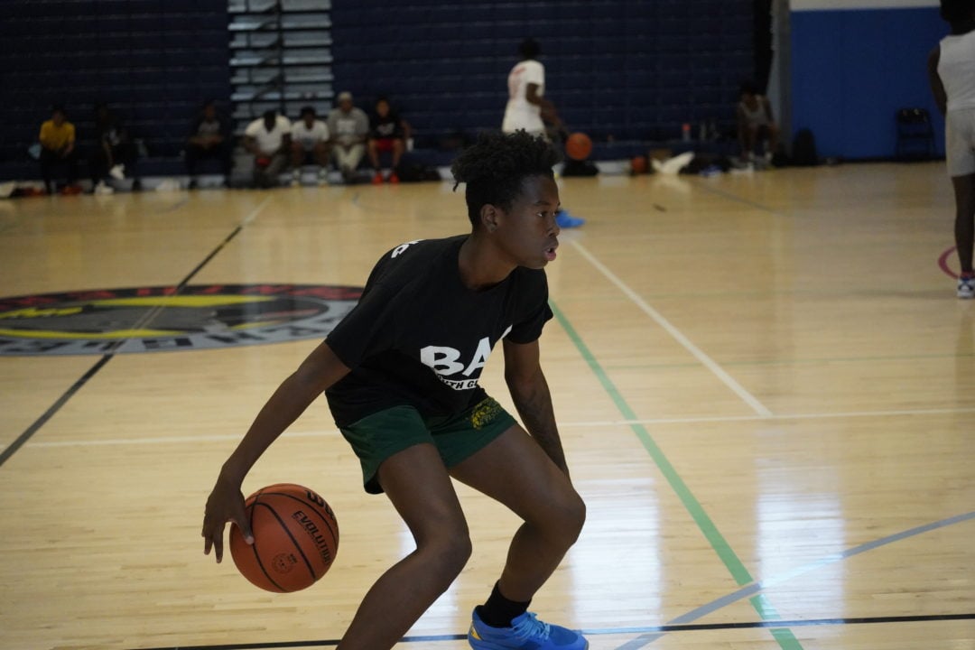 image of student playing basketball