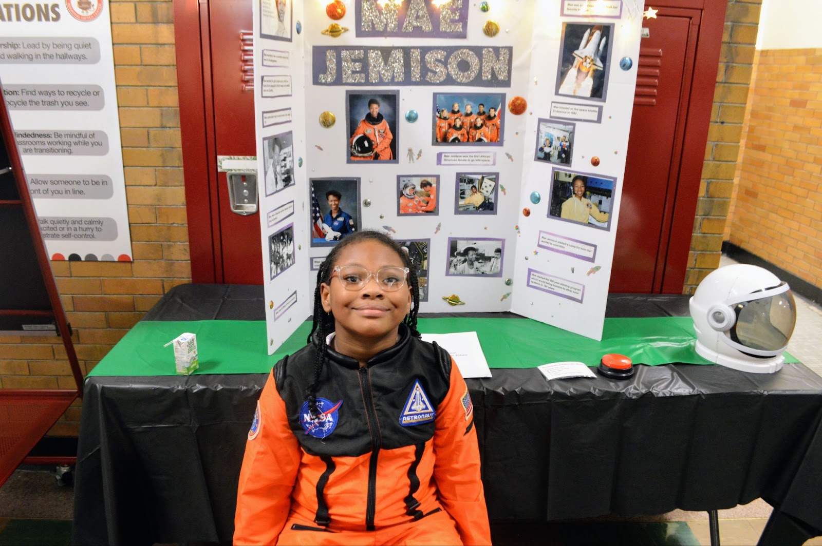 a student with her project board