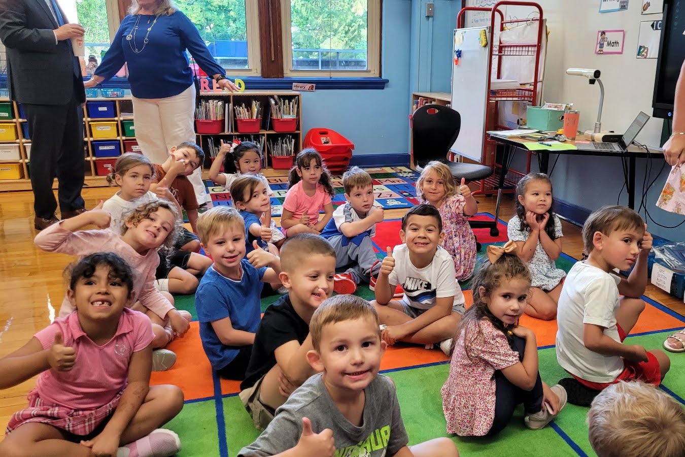 students on class rug