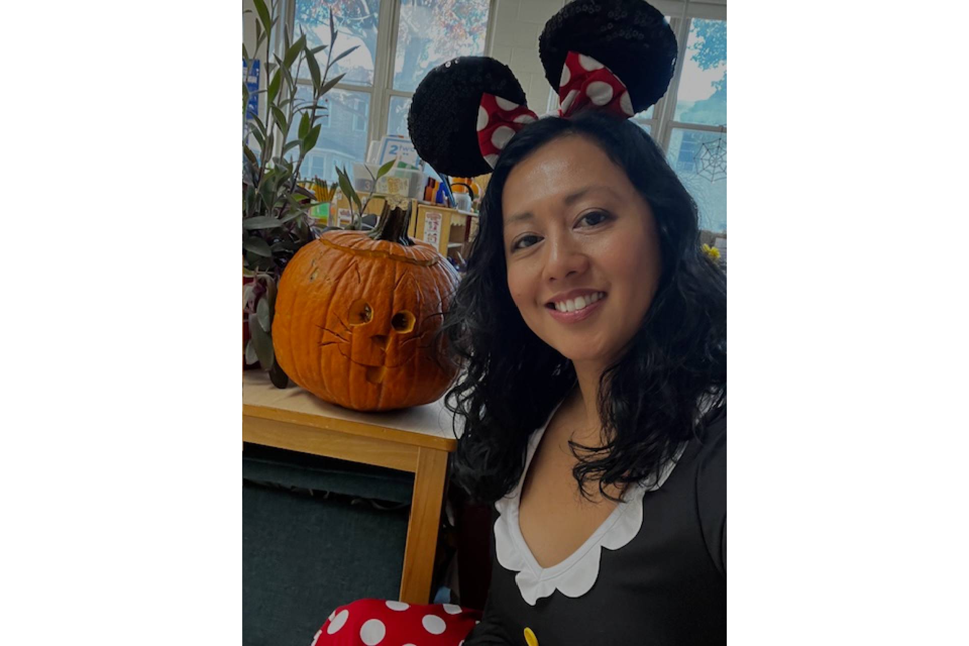 Ms. Dela Cruz, a pre-k teacher at Yates Elementary, dressed as Minnie Mouse in her classroom.