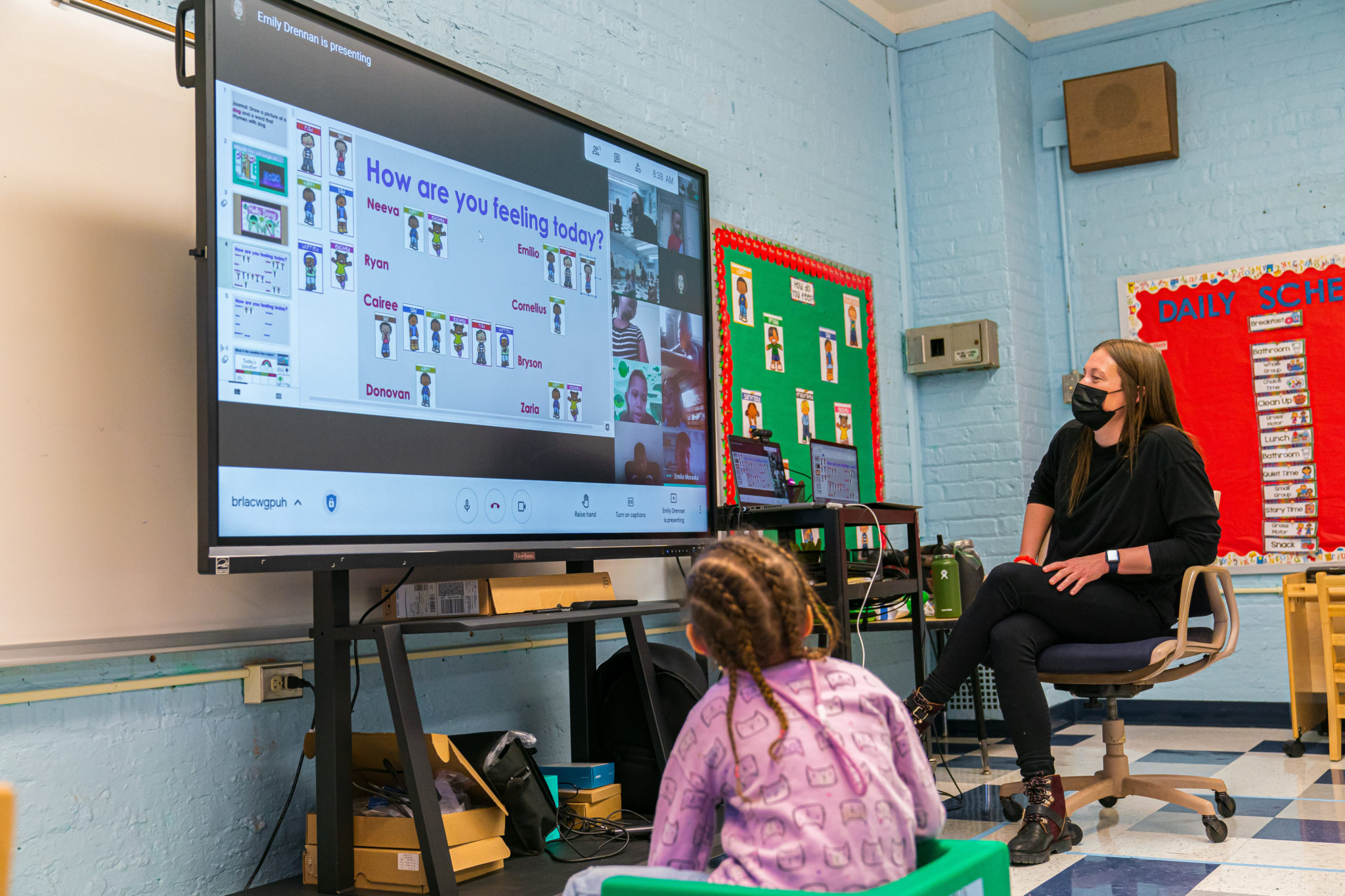 A teacher using a smart board