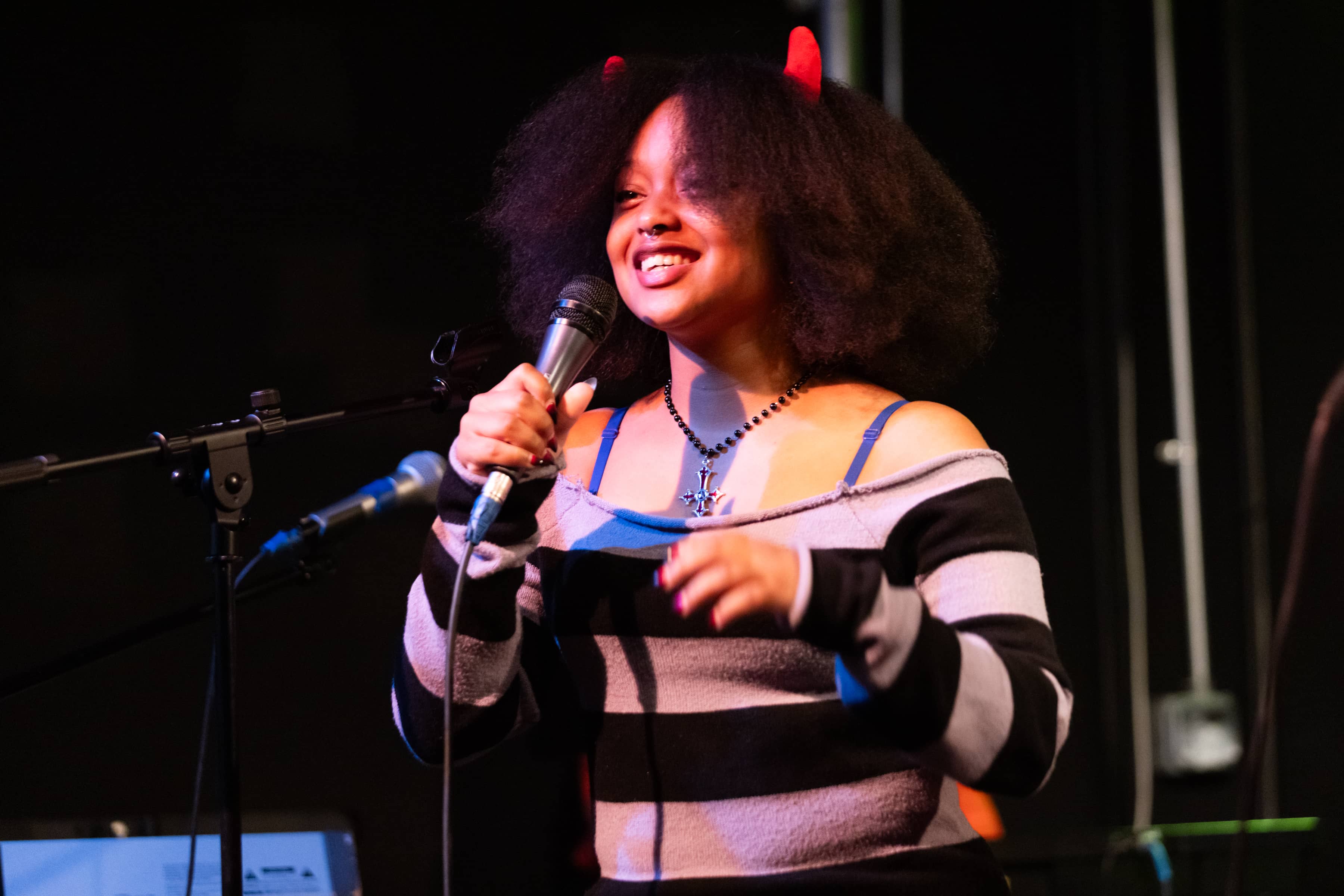 student performer on microphone